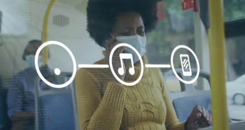 Masked Woman on Bus Using Phone with Digital Animation Overlay