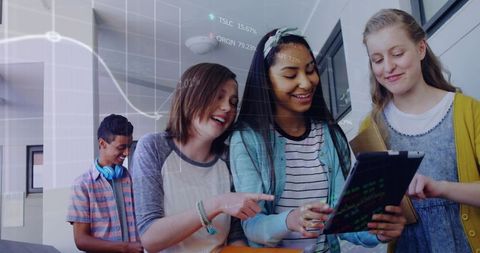 Diverse students collaborating on digital tablet with data overlay