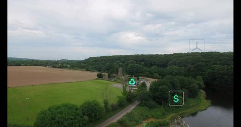 Church ruin in riverside woodlands surrounded by farmland