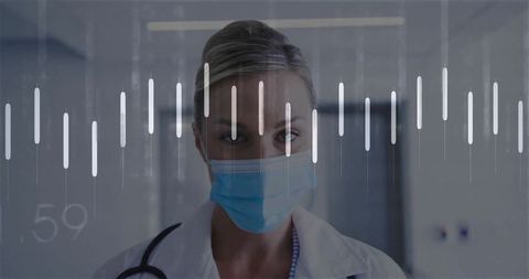 Healthcare Professional with Medical Waveform Overlay in Hospital Corridor