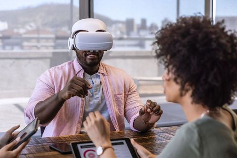 Diverse Team Collaborating in Office with VR Technology