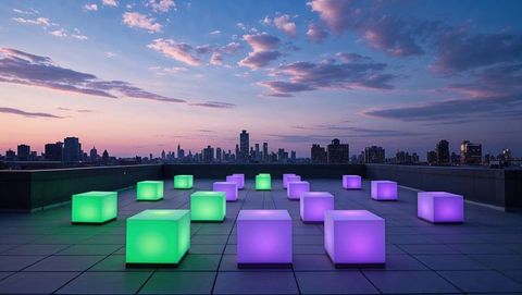 Futuristic neon cubes on rooftop at dusk with city skyline