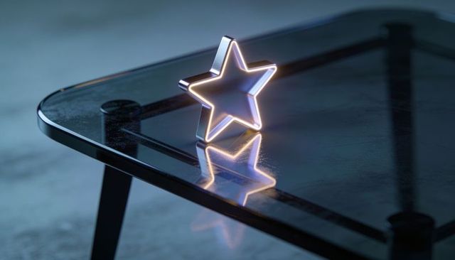 Glowing star led ornament casting reflection on glass table in cool minimalist interior