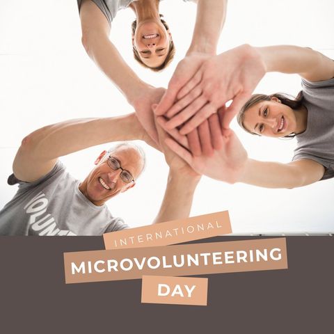 Joyful volunteers joining hands on microvolunteering day celebration