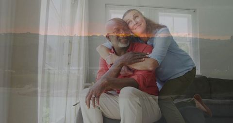 Senior Couple Embracing in Comfortable Living Room Setting