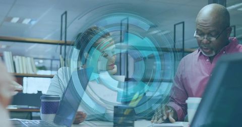 Business Professionals Strategizing with Futuristic Technology Overlay