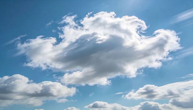 Sunlit Cumulus Cloudscape with Wispy Streaks over Vivid Blue Sky