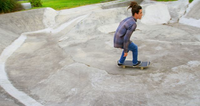 Young Man Skateboarding in Outdoor Skatepark with Concrete Ramps - Download Free Stock Images Pikwizard.com