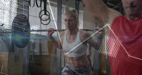 Strong woman weightlifting at gym with virtual stats overlay