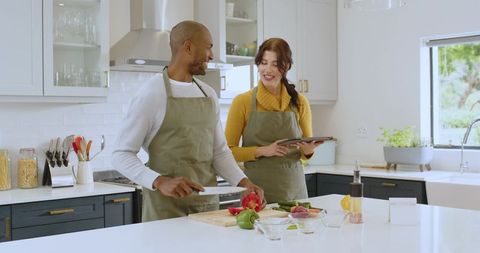 Diverse Couple Cooking Together Enjoying Modern Kitchen Lifestyle