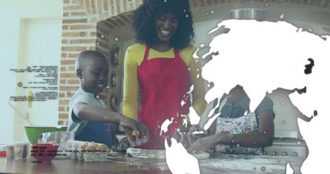 Family baking together at kitchen island teaching kids to mix dough and decorate cookies