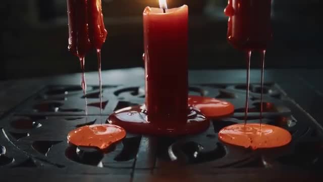 Burning Red Candles Dripping Wax