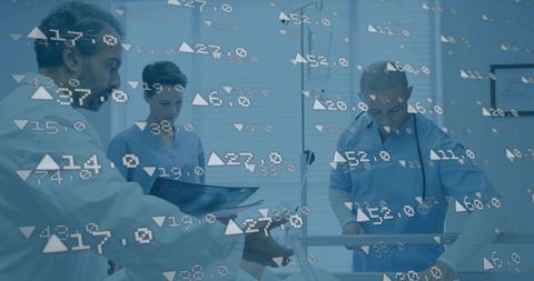 Healthcare professionals reviewing digital patient data in hospital setting