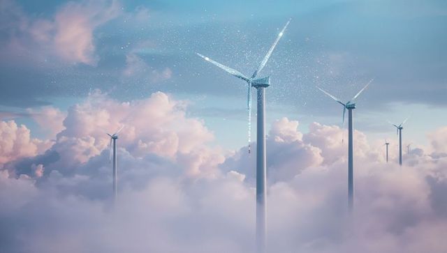 Modern wind turbines above glowing pink clouds