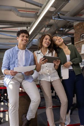 Young Coworkers Collaborating in Modern Office Setting