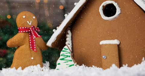 Gingerbread man and house with holiday snow