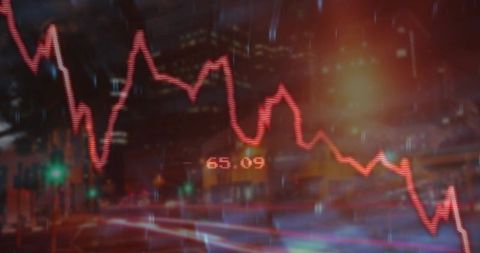 Declining Stock Market Chart Overlap with Night Cityscape