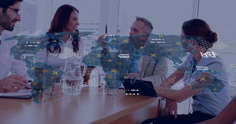Business team collaborating with global digital map overlay at meeting table for analytics