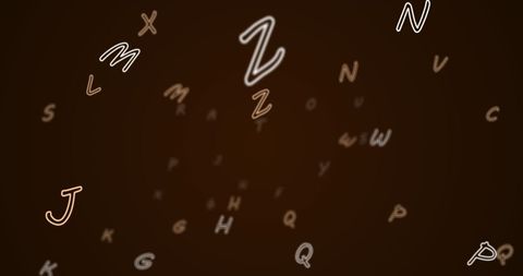 Floating alphabet letters on dark background for education concept