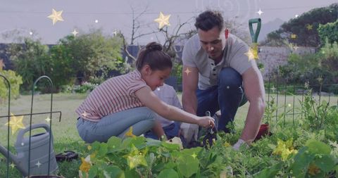 Father and Daughter Bonding While Gardening in Backyard