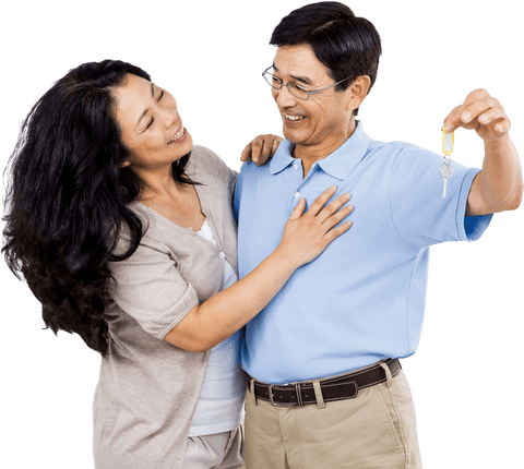 Smiling couple holding keys illustrating homeownership success