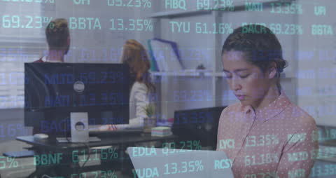 Focused Businesswoman Analyzing Complex Data in Modern Office