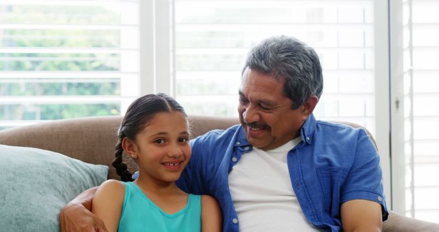 Grandfather Bonding With Granddaughter on Couch - Download Free Stock Images Pikwizard.com