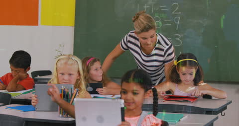 Digital Learning with Teacher Guiding Students in Classroom