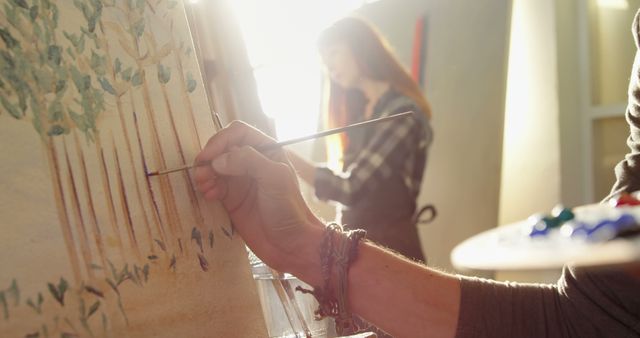 Artist Painting Trees in Sunlit Art Studio - Download Free Stock Images Pikwizard.com