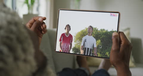 Relaxed Home Viewing of Global Sports Event on Tablet