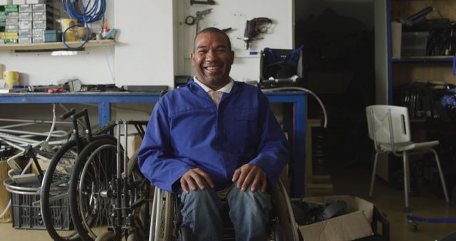 Smiling man in wheelchair in repair workshop - Download Free Stock Images Pikwizard.com