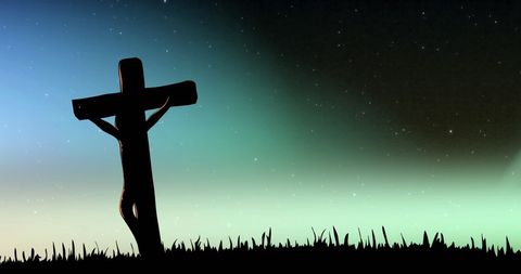 Silhouette of Wooden Cross under Aurora Sky in Winter