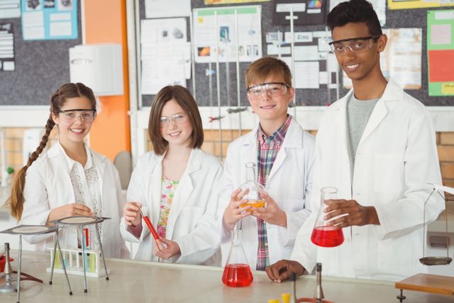 Portrait of school kids doing a chemical experiment in laboratory at school