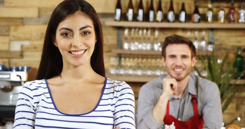 Confident Young Woman in Kitchen with Smiling Colleague - Download Free Stock Images Pikwizard.com