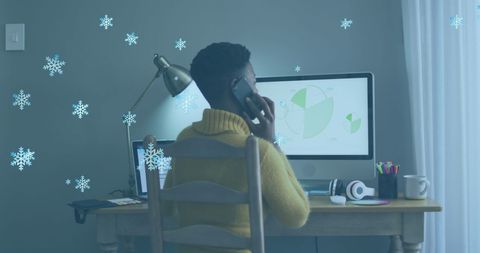 African American Woman on Phone with Snowflake Animation in Home Office - Download Free Stock Images Pikwizard.com