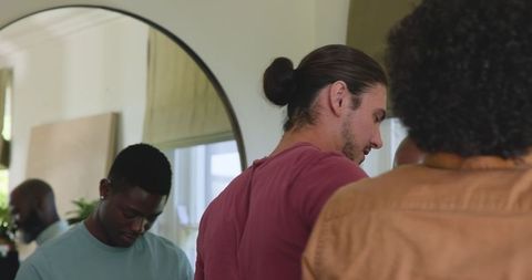 Friends Discussing Wedding Attire Options at Home Gathering