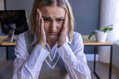 Businesswoman stress management in modern office environment