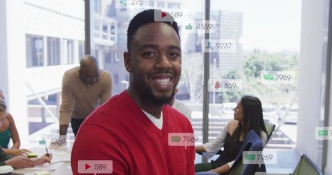 Smiling professional with social media interaction notifications