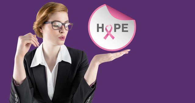Image of hope text with pink ribbon over young woman. breast cancer positive awareness campaign concept digitally generated image.