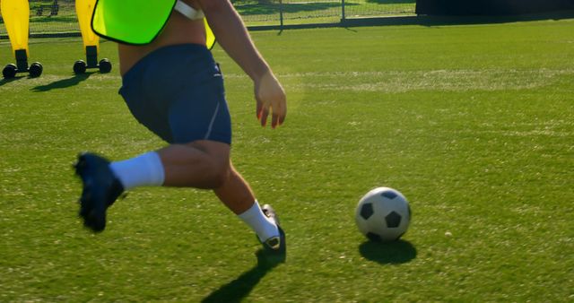 Soccer player in action on a sunny day at the field. Captures the dynamic movement and energy of outdoor sports.
