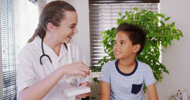 Smiling Pediatrician Showing Anatomical Model to Happy Child - Download Free Stock Images Pikwizard.com