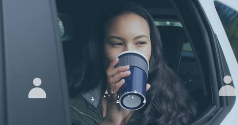 Young Woman Enjoying Coffee While Relaxing in Car