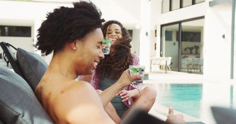 Happy Interracial Couple Enjoying Drinks by Poolside on Vacation - Download Free Stock Images Pikwizard.com
