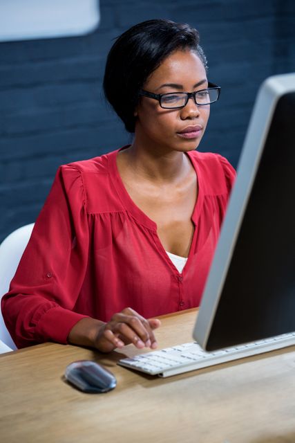 Woman working on computer in office