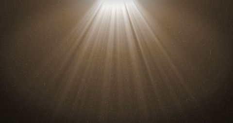 Radiant Light Rays and Falling Particles Over Dark Backdrop - Download Free Stock Images Pikwizard.com