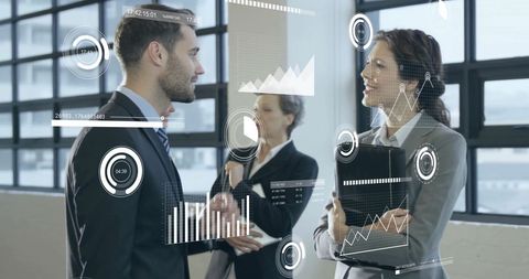 Business Professionals Analyzing Digital Data Visualization in Office