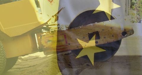 Vibratory road roller with eu stars overlay at construction site