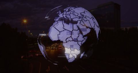 Digital globe overlaying city traffic with network connections