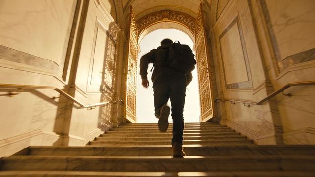 Climbing man ascending marble staircase toward sunlit gilded gate and arched exit
