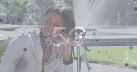 Woman Using Smartphone with 5G Network Overlay in Urban Setting